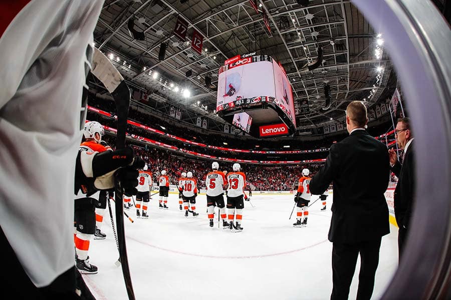 RALEIGH, NORTH CAROLINA - OCTOBER 11: The Philadelphia Flyers await the ruling on a goal during the overtime period of the game against the Carolina Hurricanes at Lenovo Center on October 11, 2025 in Raleigh, North Carolina.