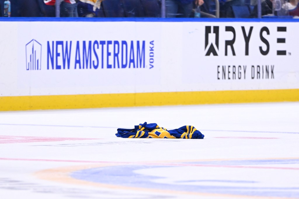 A Buffalo Sabres fan throws their jersey onto the ice following an NHL game against the Colorado Avalanche.