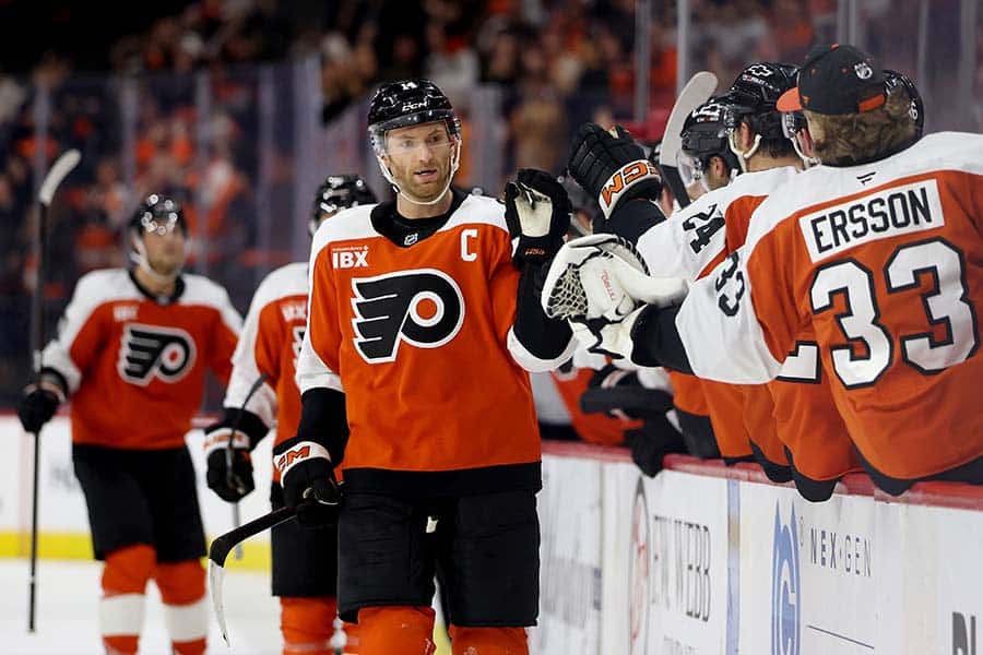 PHILADELPHIA, PENNSYLVANIA - OCTOBER 13: Sean Couturier #14 of the Philadelphia Flyers celebrates his goal during the third period against the Florida Panthers at Xfinity Mobile Arena on October 13, 2025 in Philadelphia, Pennsylvania.