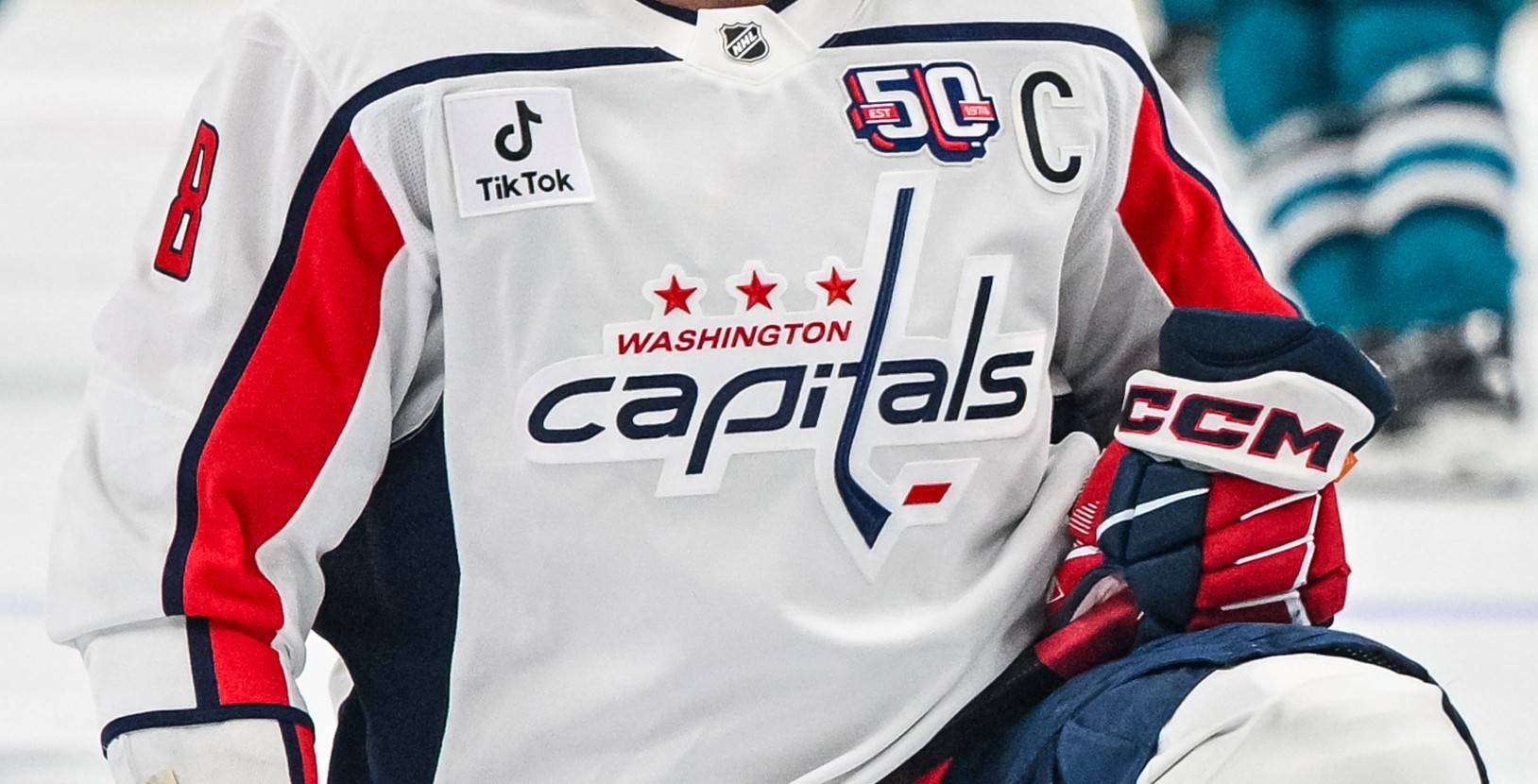 Washington Capitals logo against the San Jose Sharks