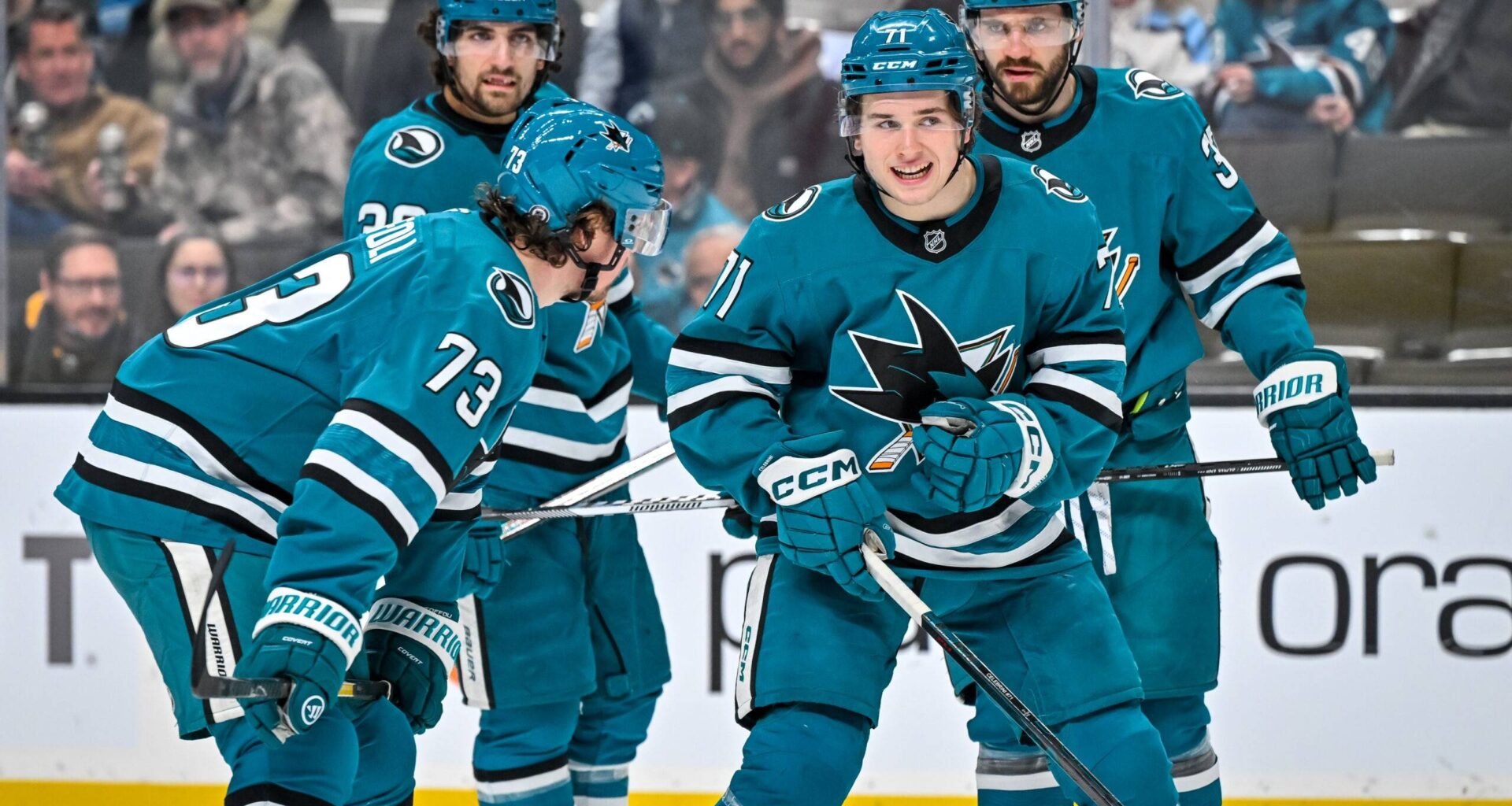 San Jose Sharks forward Macklin Celebrini talks to his teammates before a face-off.