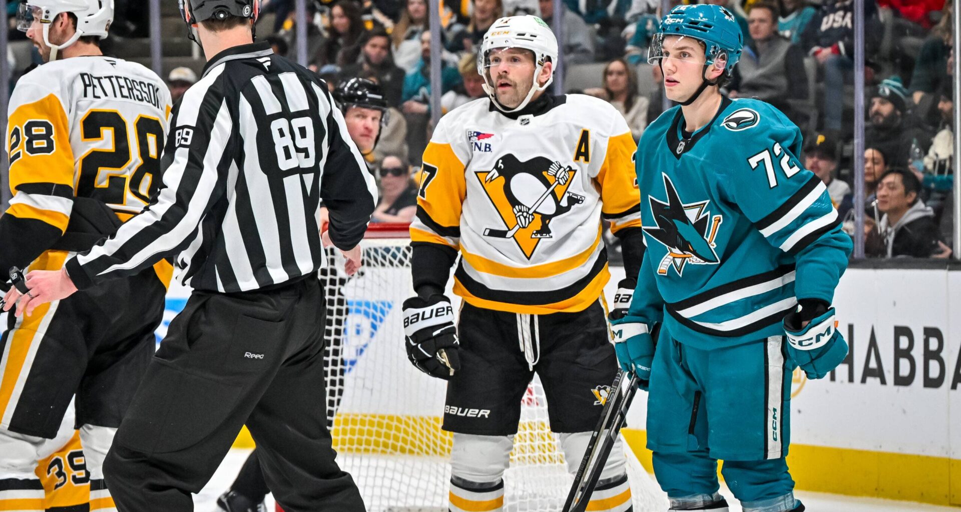 San Jose Sharks forward William Eklund stands next to Pittsburgh Penguins forward Bryan Rust