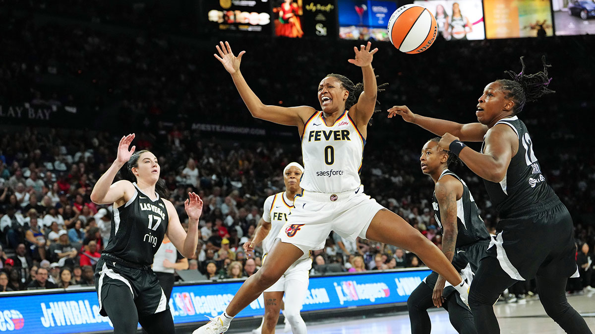 Las Vegas Aces guard Chelsea Gray (12) tips the ball away from Indiana Fever guard Kelsey Mitchell (0) during the second quarter of game five of the second round for the 2025 WNBA Playoffs at Michelob Ultra Arena.