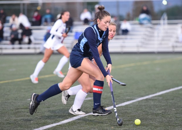 North Penn's Kylie Barwis, 24, drives down the field as Central Bucks East's Brynn Williamson, 20, defends during their District 1-3A first round game on Monday, Oct. 20, 2025. (Mike Cabrey/MediaNews Group)
