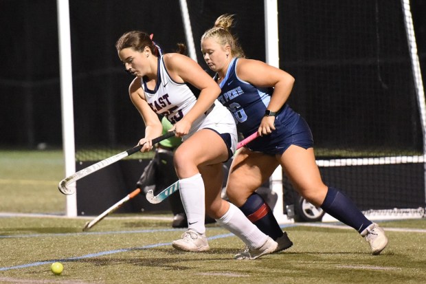 Central Bucks East's Brynn Bonargo, 25, with the ball as North Penn's Tallie Smink, 36, defends during their District 1-3A first round game on Monday, Oct. 20,