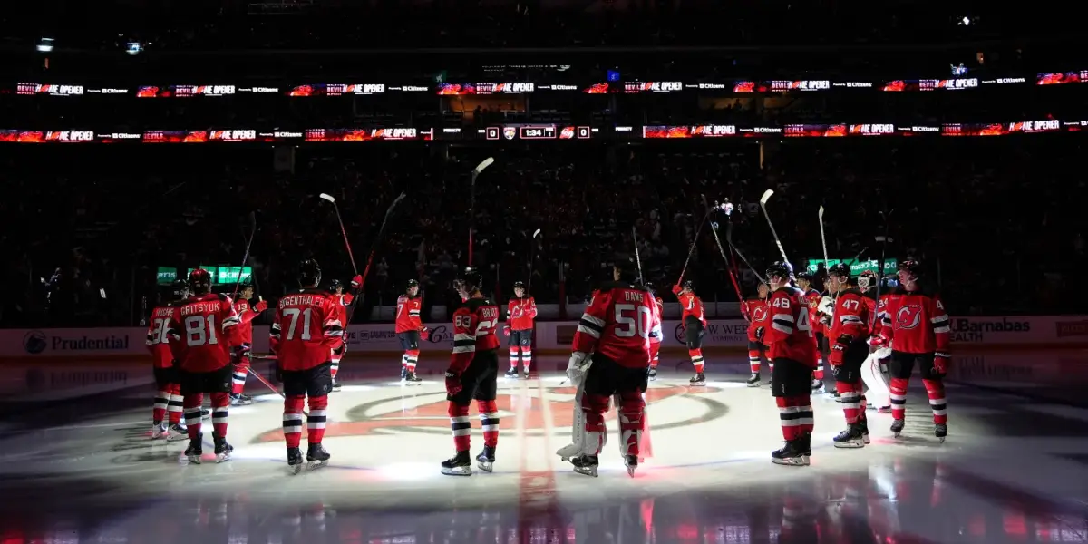 New Jersey Devils salute the fans in the home opener at the Prudential Center on Thursday night.