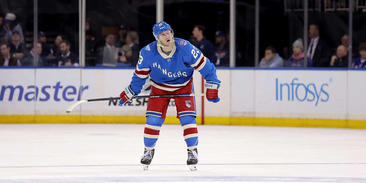New York Rangers forward J.T. Miller (8) skates with the puck against the Toronto Maple Leafs in the first period at Scotiabank Arena
