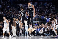 San Antonio Spurs forward/center Victor Wembanyama (1) celebrates his reverse dunk with...