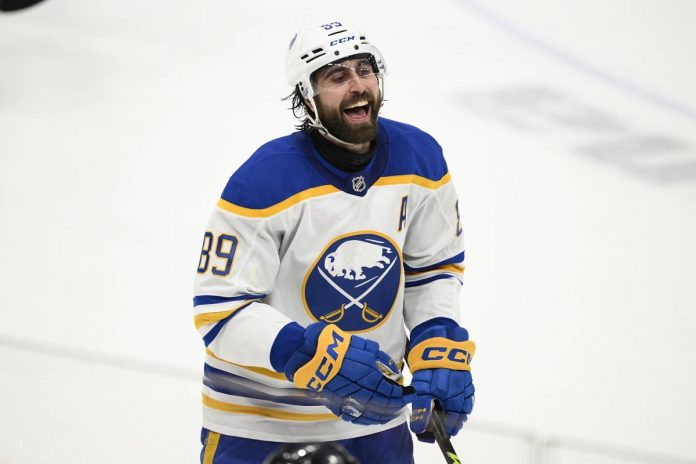 Buffalo Sabres right wing Alex Tuch celebrates after his goal during the third period of an NHL hockey game against the Washington Capitals, Sunday, March 30, 2025, in Washington. (AP Photo/Nick Wass) NHL