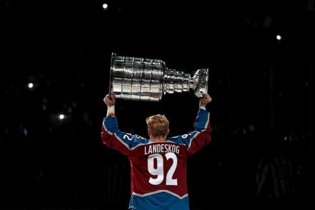 Gabriel Landeskog (92) of the Colorado Avalanche hoists the Stanley Cup during a championship celebration before the first period against the Chicago Blackhawks at Ball Arena in Denver on Wednesday, October 12, 2022. (Photo by AAron Ontiveroz/The Denver Post)