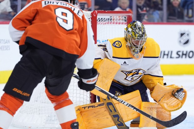 The Flyers' Jamie Drysdale takes a shot on Predators goalie Juuse Saros on Thursday, Oct. 30, 2025, in Philadelphia. (AP Photo/Matt Slocum)