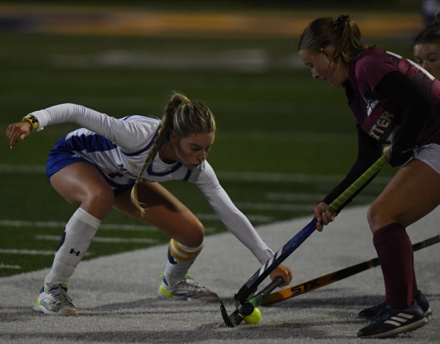 Bloomfield Hills Marian's Kamryn Draper (L) defends against Dexter's Claire...