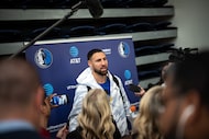 Dallas Mavericks' Klay Thompson speaks to reporters at NBA basketball training camp at Simon...
