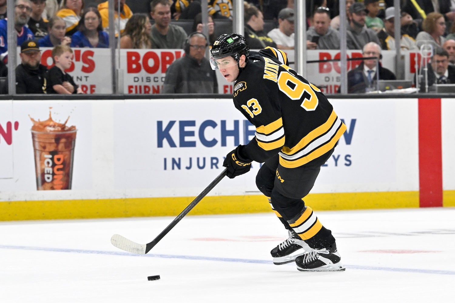 Oct 4, 2025; Boston, Massachusetts, USA; Boston Bruins center Fraser Minten (93) controls the puck against the New York Rangers during the first period at TD Garden. Mandatory Credit: Eric Canha-Imagn Images