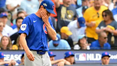 Oct 4, 2025; Milwaukee, Wisconsin, USA; Chicago Cubs manager Craig Counsell (11) reacts as he walks onto the field to make a pitching change against the Milwaukee Brewers during the second inning of game one of the NLDS round for the 2025 MLB playoffs at American Family Field.