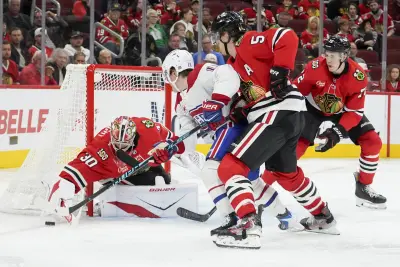 Oct 11, 2025; Chicago, Illinois, USA; Montréal Canadiens right wing Cole Caufield (13) shoots the puck on Chicago Blackhawks goaltender Spencer Knight (30) during the second period at United Center. 
