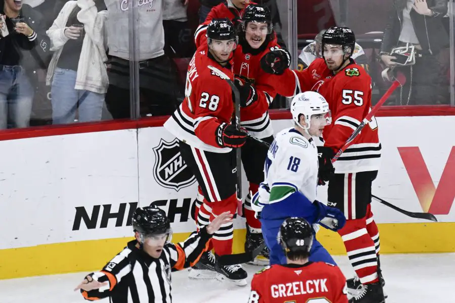Chicago Blackhawks left wing Tyler Bertuzzi (59), center, reacts after a referee overturned his goal