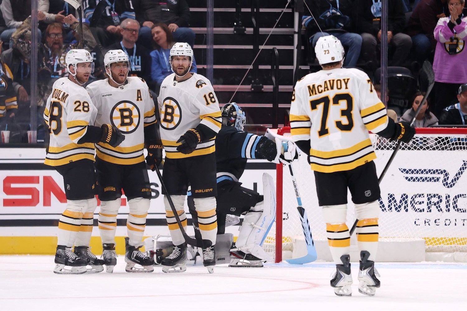 Oct 19, 2025; Salt Lake City, Utah, USA; Boston Bruins right wing David Pastrnak, second from left, scores a goal against the Utah Mammoth during the first period at Delta Center. Mandatory Credit: Rob Gray-Imagn Images