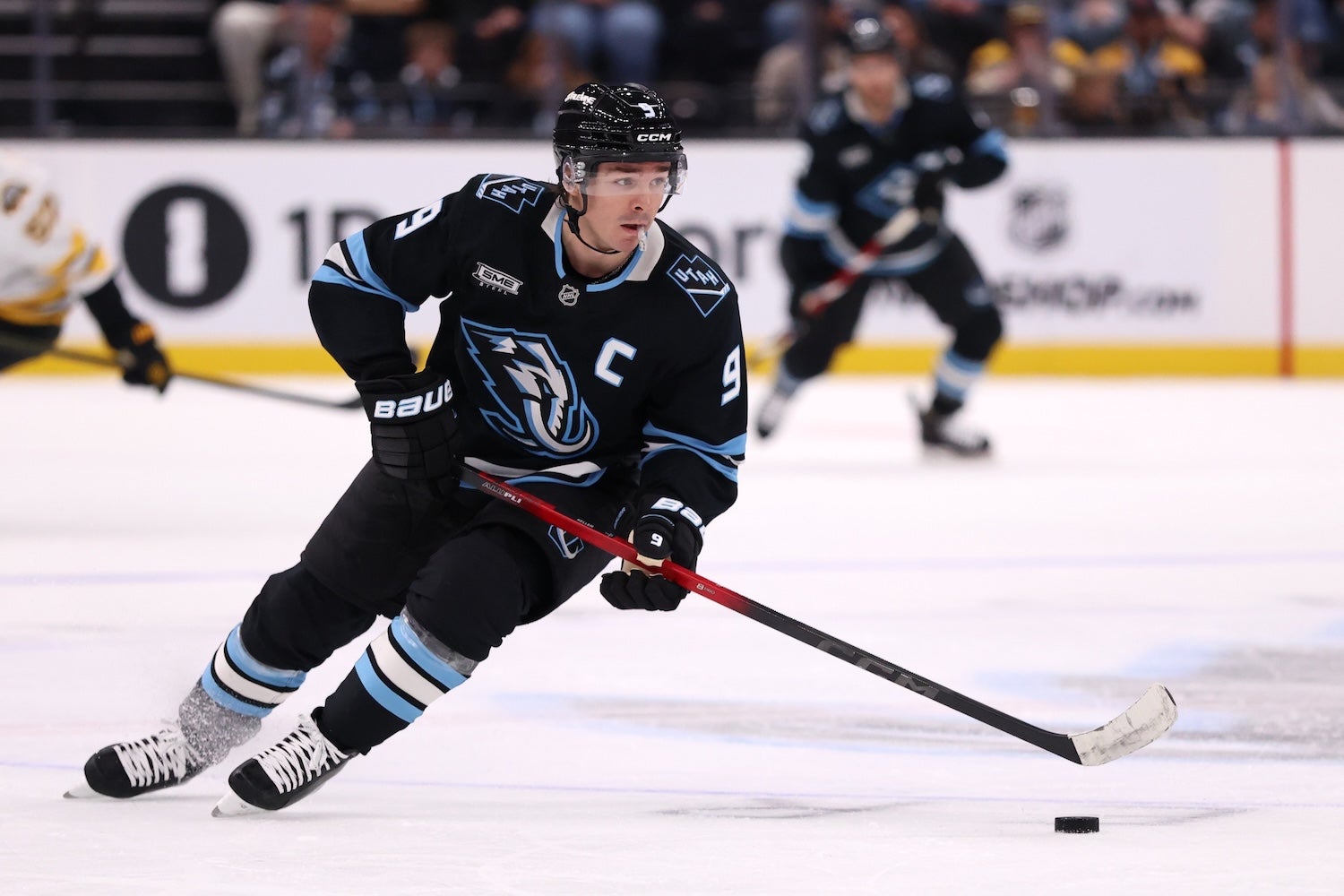 Oct 19, 2025; Salt Lake City, Utah, USA; Utah Mammoth right wing Clayton Keller (9) skates with the puck against the Boston Bruins during the first period at Delta Center. Mandatory Credit: Rob Gray-Imagn Images