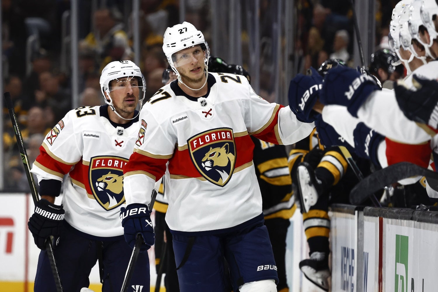 Oct 21, 2025; Boston, Massachusetts, USA; Florida Panthers center Eetu Luostarinen (27) is congratulated at the bench with left wing Brad Marchand (63) after Luostarinen’s goal against the Boston Bruins during the third period at TD Garden. Mandatory Credit: Winslow Townson-Imagn Images
