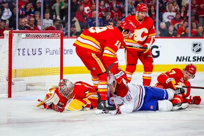 Calgary Flames players react during 2025 game.