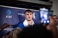 Dallas Mavericks' Cooper Flagg speaks with reporters at NBA basketball training camp at...