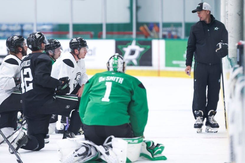 Dallas Stars new head coach Glen Gulutzan instructs the team in a huddle during a training...