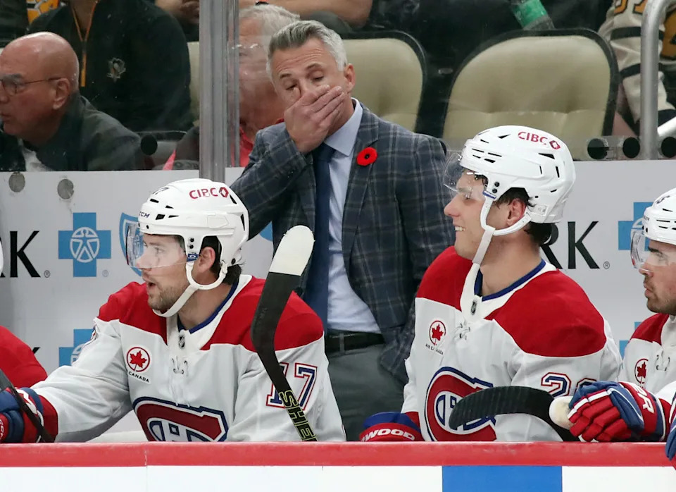 Montreal Canadiens head coach Martin St. Louis (rear) reacts on the bench.Charles LeClaire-Imagn Images