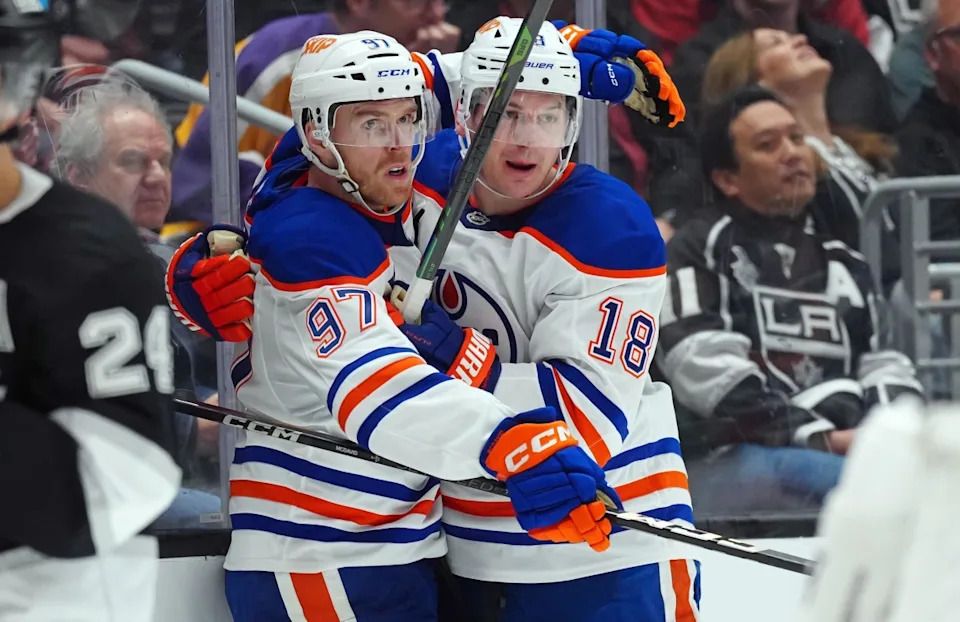 Edmonton Oilers center Connor McDavid (97) and winger Zach Hyman (18) celebrate after a goal against the Los Angeles Kings during the 2025 playoffs.Kirby Lee-Imagn Images