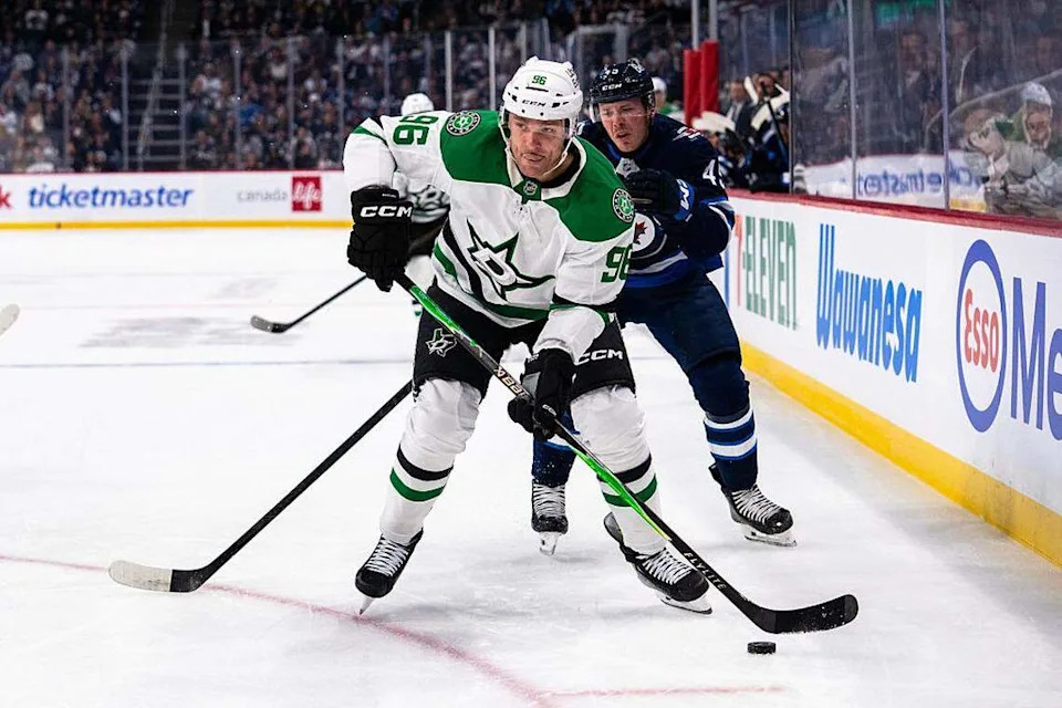 Mikko Rantanen (96) of the Dallas Stars skates with the puck in the first period against the Winnipeg Jets at Canada Life Centre on October 9, 2025 in Winnipeg, Canada at Canada Life Centre on October 9, 2025 in Winnipeg, Canada.