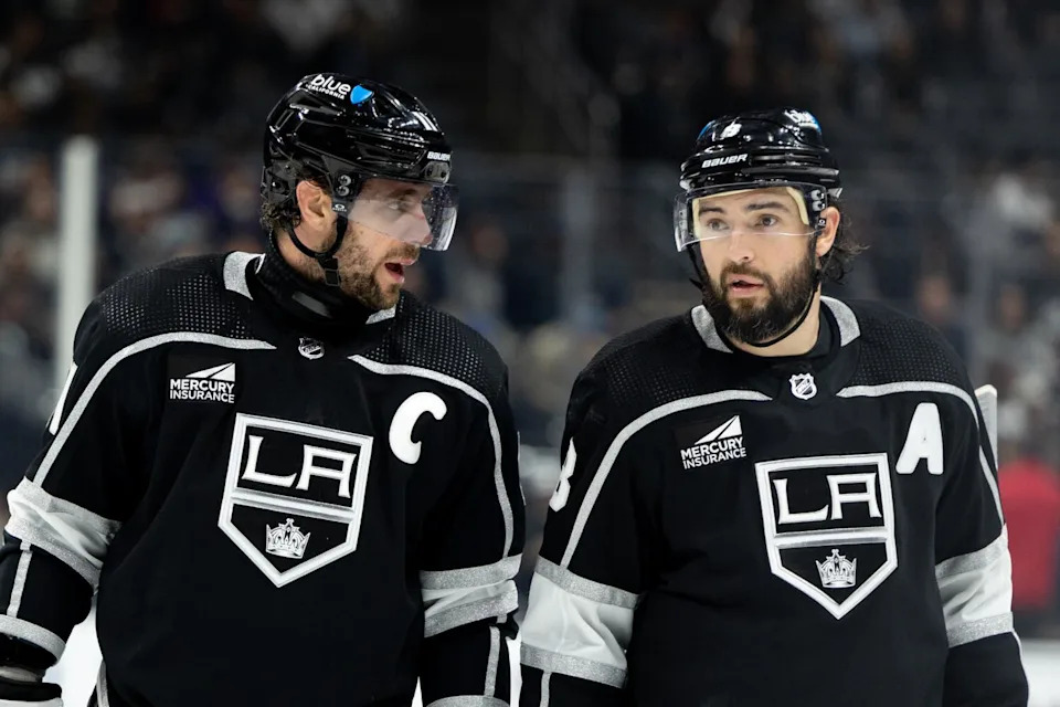 Kings captain Anze Kopitar, left, speaks to defenseman Drew Doughty.