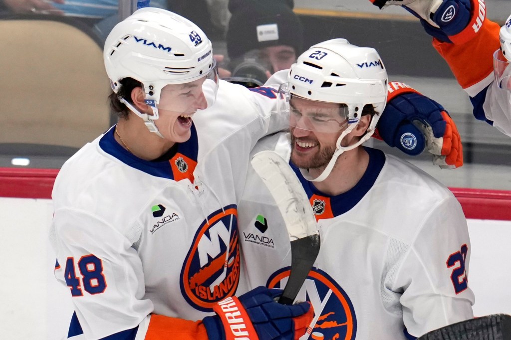 Jonathan Drouin (29) celebrates his goal with Matthew Schaefer (48) in an NHL hockey game.