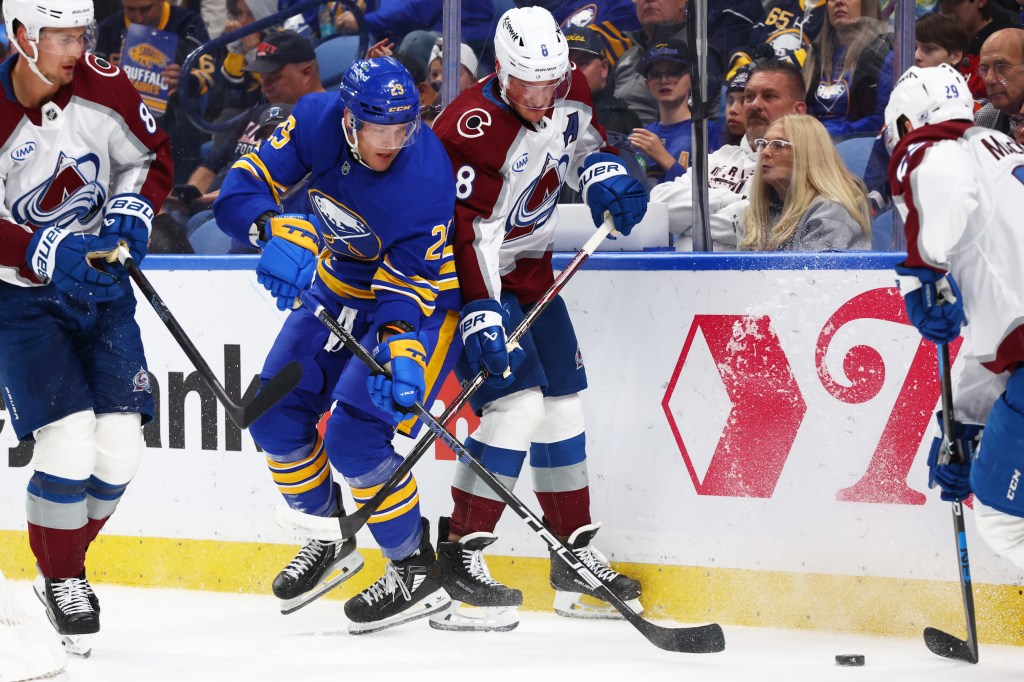 Beck Malenstyn (29) and Colorado Avalanche defenseman Cale Makar (8) battle for the puck behind the net during the first period of an NHL hockey game Monday, Oct. 13, 2025.