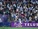 Whitecaps' Daniel Rios, left, and Tate Johnson celebrate Rios' goal against FC Dallas during the first half at B .C. Place on Sunday night