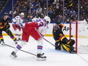 New York Rangers' Mika Zibanejad (93) scores against Thatcher Demko during the first period at Rogers Arena on Tuesday night