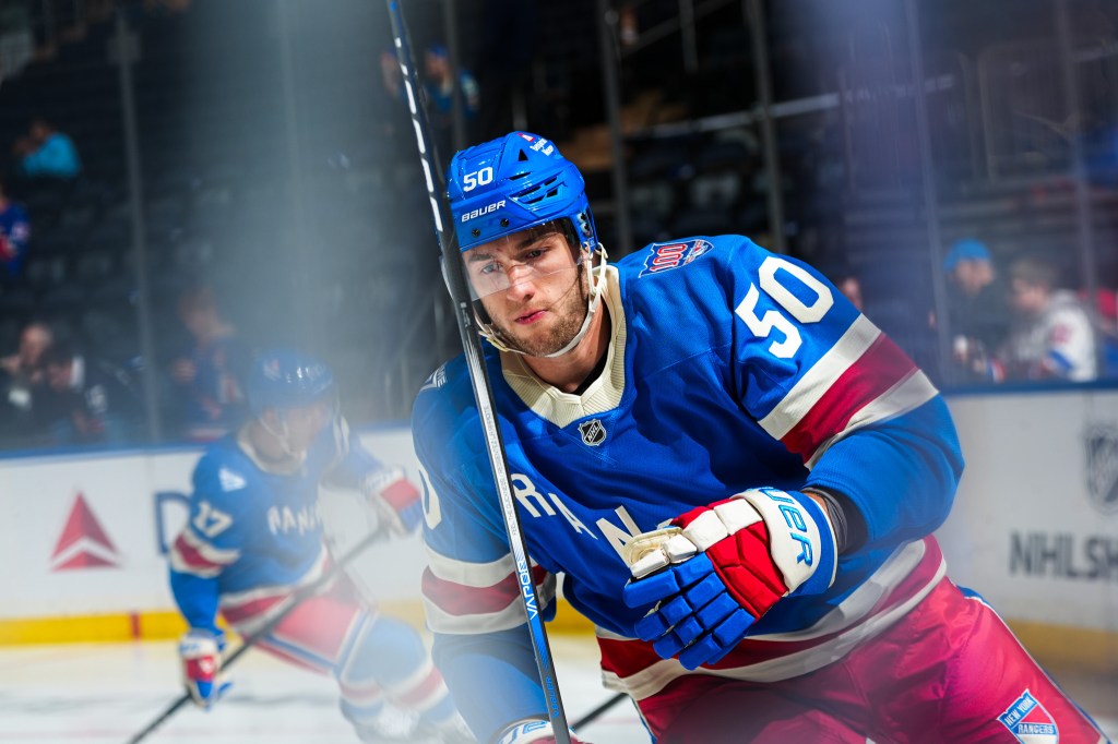 New York Rangers player Will Cuylle #50 skates during warmups.