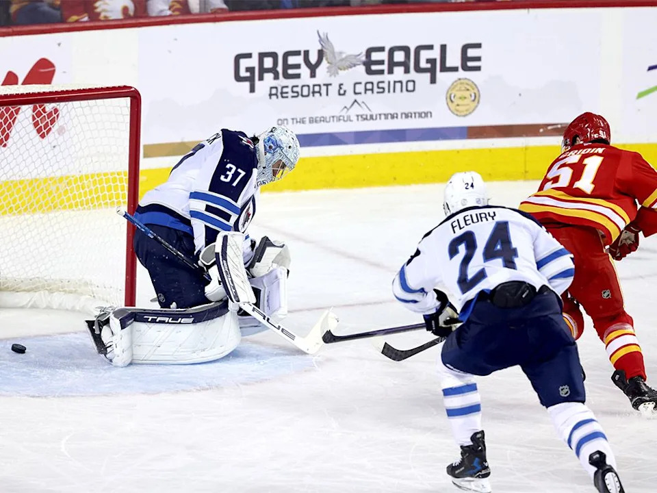  Matvei Gridin scores on Winnipeg Jets goalie Connor Hellebuyck during pre-season action.