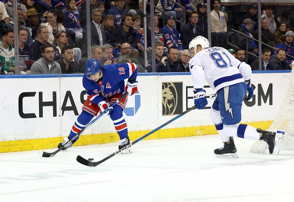 Rangers left wing Artemi Panarin #10 moves the puck as Tampa Bay Lightning defenseman Erik Cernak #81 rushes to defend. Charles Wenzelberg / New York Post