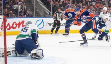 Oilers net first win via 3-1 decision over Canucks