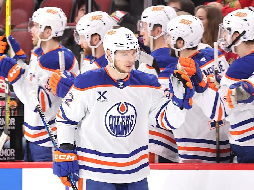  Vasily Podkolzin #92 of the Edmonton Oilers high fives teammates after scoring a goal against the Chicago Blackhawksduring the second period at the United Center on January 11, 2025 in Chicago, Illinois.