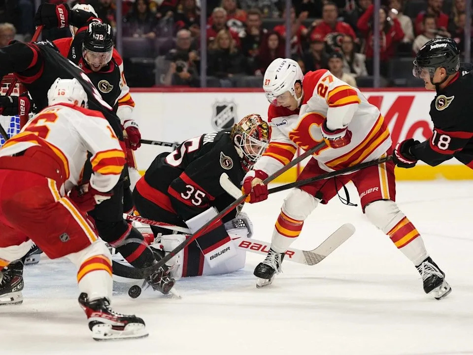  Flames forward Matt Coronato scores on Senators goaltender Linus Ullmark during Thursday’s game.