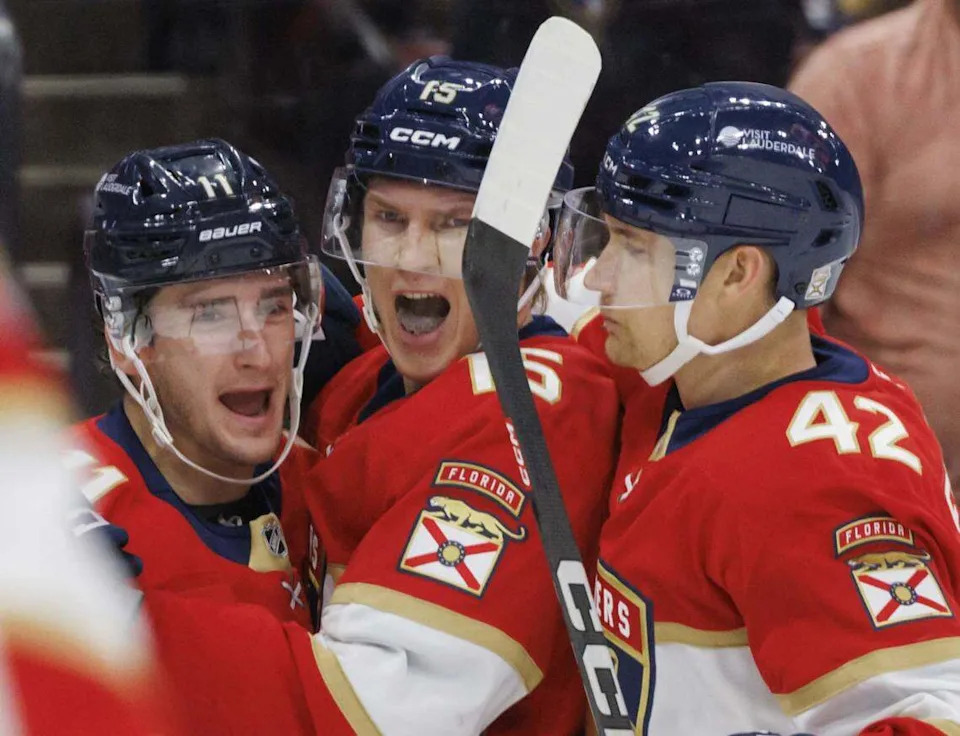Florida Panthers center Anton Lundell (15) celebrates his goal with right wing Mackie Samoskevich (11) and defenseman Gustav Forsling (42) during the third period of a game on Tuesday, Oct. 28, 2025, at Amerant Bank Arena in Sunrise, Fla. The Anaheim Ducks won 3-2 in a shootout.