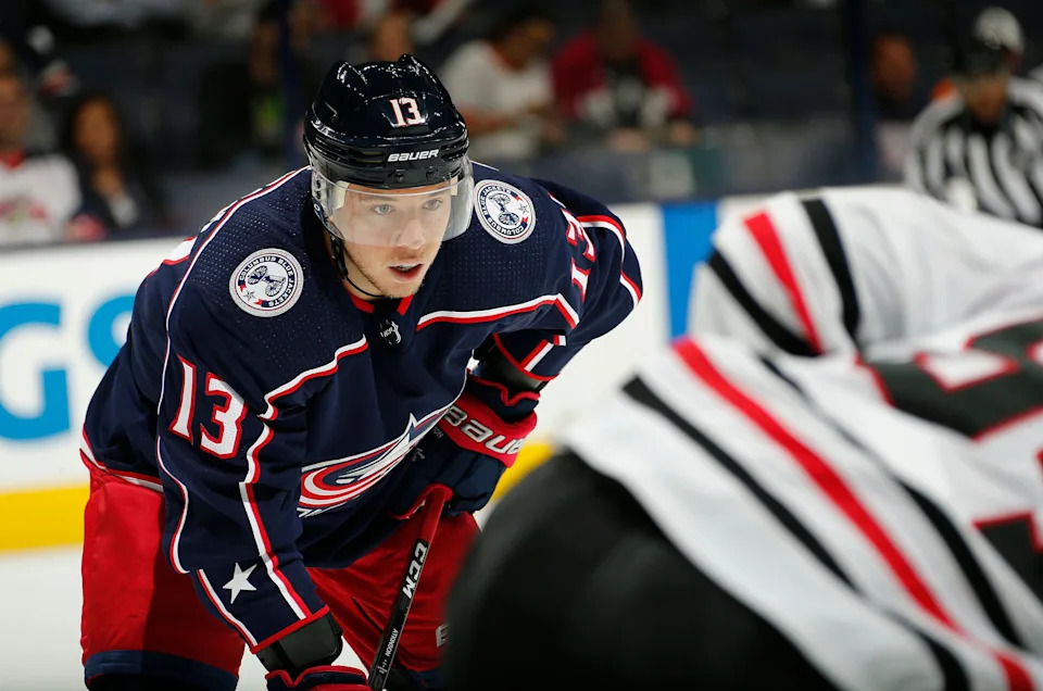 Columbus Blue Jackets forward Cam Atkinson (13) lines up for a face-off during the first period of the NHL preseason hockey game against the Chicago Blackhawks at Nationwide Arena in Columbus on Sept. 18, 2018.