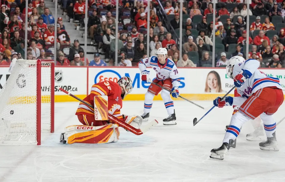 Noah Laba #42 of the New York Rangers scores on Dustin Wolf #32 of the Calgary Flames during the first period at the Scotiabank Saddledome on October 26, 2025, in Calgary, Alberta, Canada. Getty Images