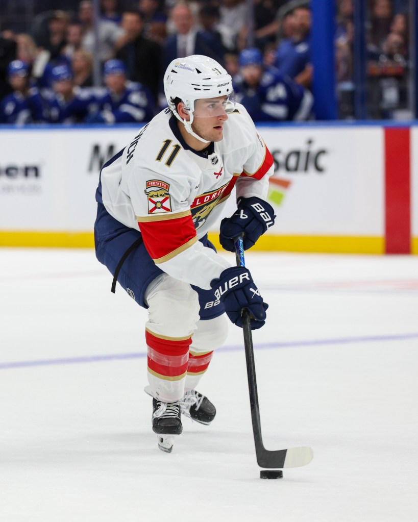 Florida Panthers right wing Mackie Samoskevich (11) controls the puck.