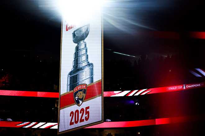 SUNRISE, FLORIDA - OCTOBER 07: Florida Panthers look on as their Stanley Cup banner is raised prior to a game facing the Chicago Blackhawks at Amerant Bank Arena on October 07, 2025 in Sunrise, Florida. (Photo by Carmen Mandato/Getty Images)