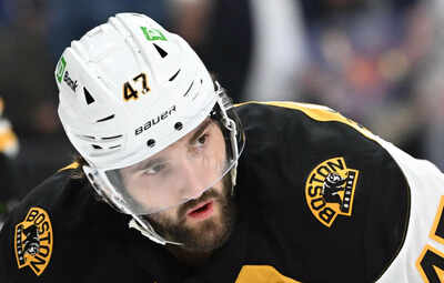 Boston Bruins’ Mark Kastelic charges at New York Ranger’s 6-foot-9 Matt Rempe refusing to flinch