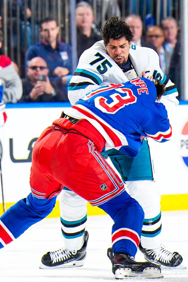 Ryan Reaves #75 of the San Jose Sharks fight in the first period at Madison Square Garden on October 23, 2025 in New York City.