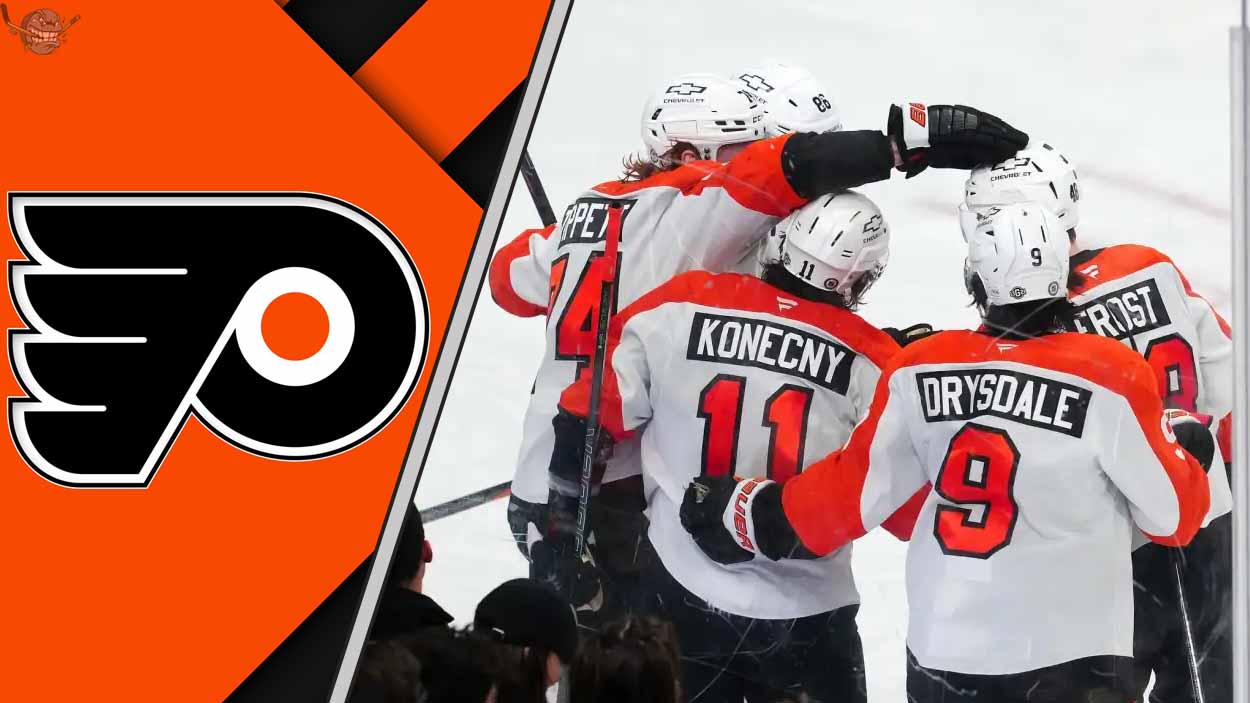 The Philadelphia Flyers team celebrating a goal on the ice, showcasing their teamwork and determination.