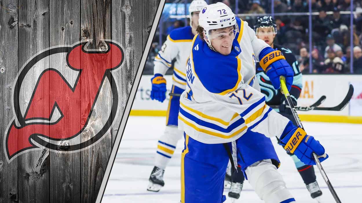 Buffalo Sabres forward Tage Thompson skates with the puck during an NHL game, with the New Jersey Devils logo in the background.